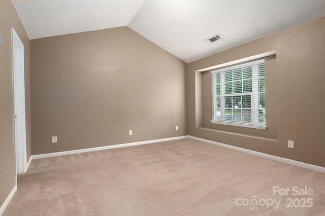 10613 Prairie Ridge Ln, Charlotte, NC 28213 - unfurnished room with light carpet and vaulted ceiling
