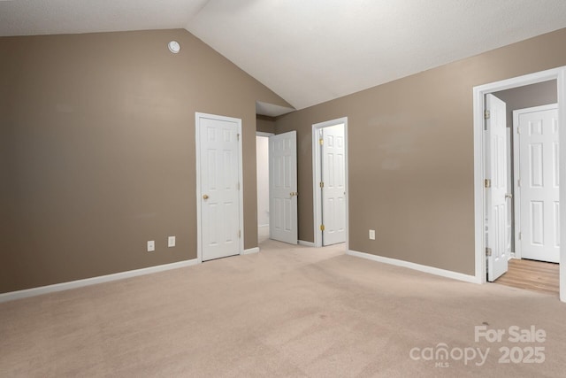 10613 Prairie Ridge Ln, Charlotte, NC 28213 - unfurnished bedroom with light colored carpet and vaulted ceiling