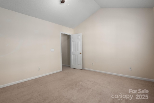 10613 Prairie Ridge Ln, Charlotte, NC 28213 - spare room with carpet floors, vaulted ceiling, and ceiling fan