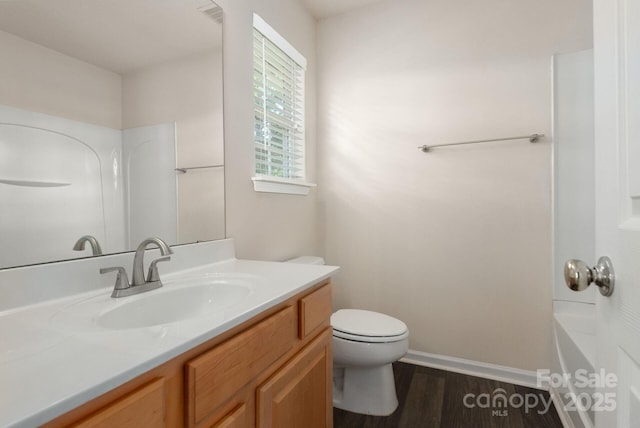 10613 Prairie Ridge Ln, Charlotte, NC 28213 - bathroom with vanity, wood finished floors, and bathtub / shower combination