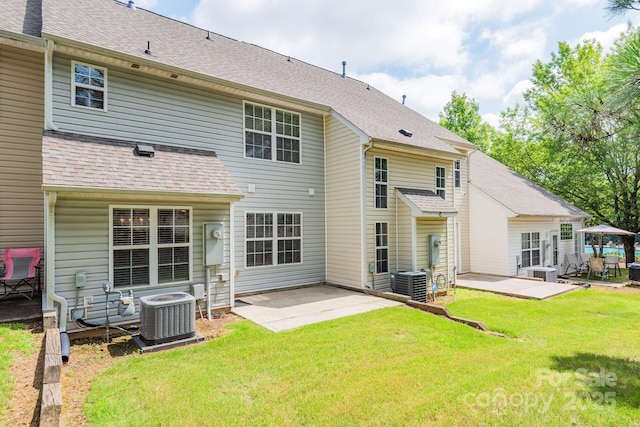 10613 Prairie Ridge Ln, Charlotte, NC 28213 - rear view of property featuring a patio, a yard, and roof with shingles