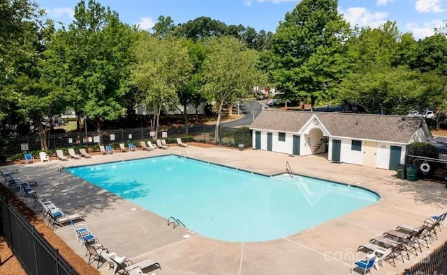 10613 Prairie Ridge Ln, Charlotte, NC 28213 - community pool with a patio and view of scattered trees