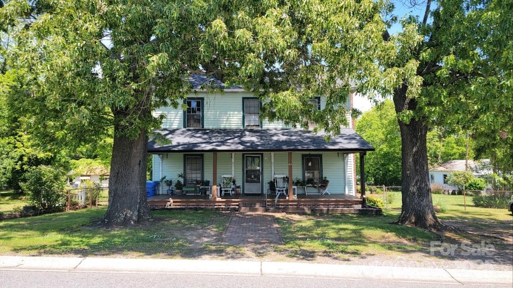 164 N Eastway Dr, Troutman, NC 28166 - view of front of house featuring covered porch and a front lawn