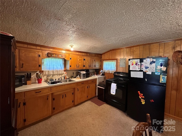 302 Margarette Ave, Belmont, NC 28012 - kitchen featuring black appliances, light countertops, light carpet, a textured ceiling, and brown cabinets