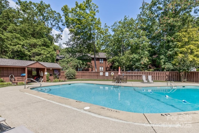 107 Cedar Forest Trl Unit 107, Asheville, NC 28803 - community pool featuring a patio area and view of scattered trees