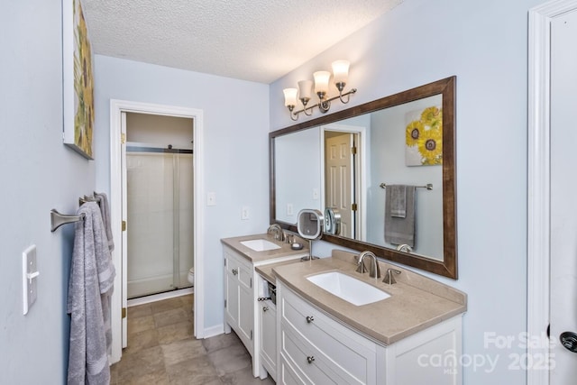 107 Cedar Forest Trl Unit 107, Asheville, NC 28803 - full bathroom featuring vanity, a textured ceiling, and a shower stall