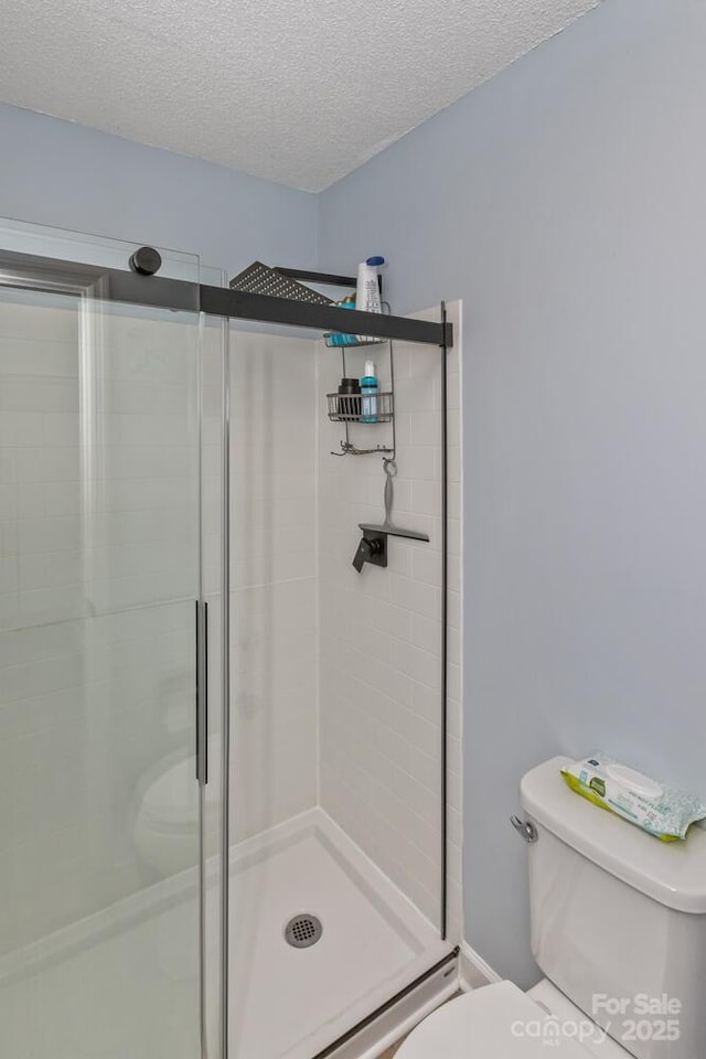 107 Cedar Forest Trl Unit 107, Asheville, NC 28803 - bathroom featuring a shower stall and a textured ceiling