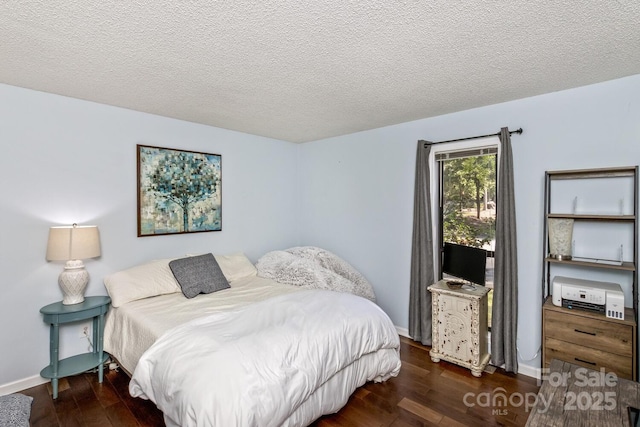 107 Cedar Forest Trl Unit 107, Asheville, NC 28803 - bedroom featuring wood finished floors and a textured ceiling