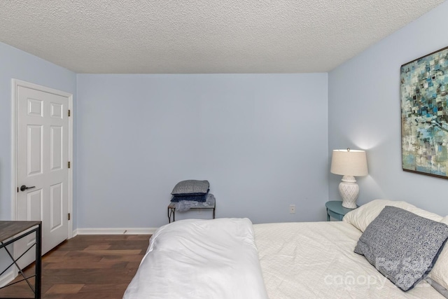 107 Cedar Forest Trl Unit 107, Asheville, NC 28803 - bedroom featuring wood finished floors and a textured ceiling