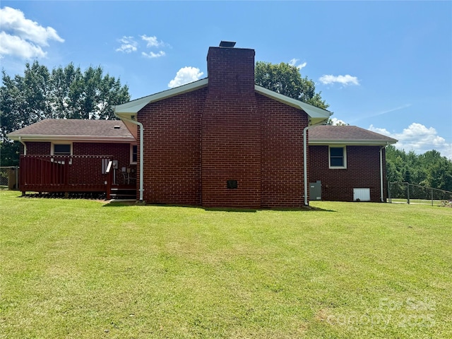 206 College Ave, Shelby, NC 28152 - rear view of property featuring brick siding, a chimney, and a wooden deck