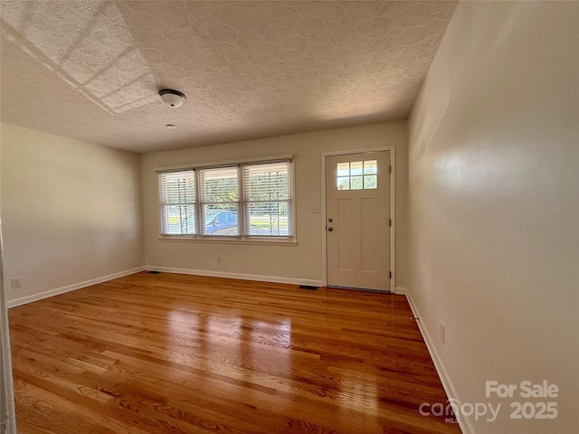 206 College Ave, Shelby, NC 28152 - foyer entrance with a textured ceiling and wood finished floors