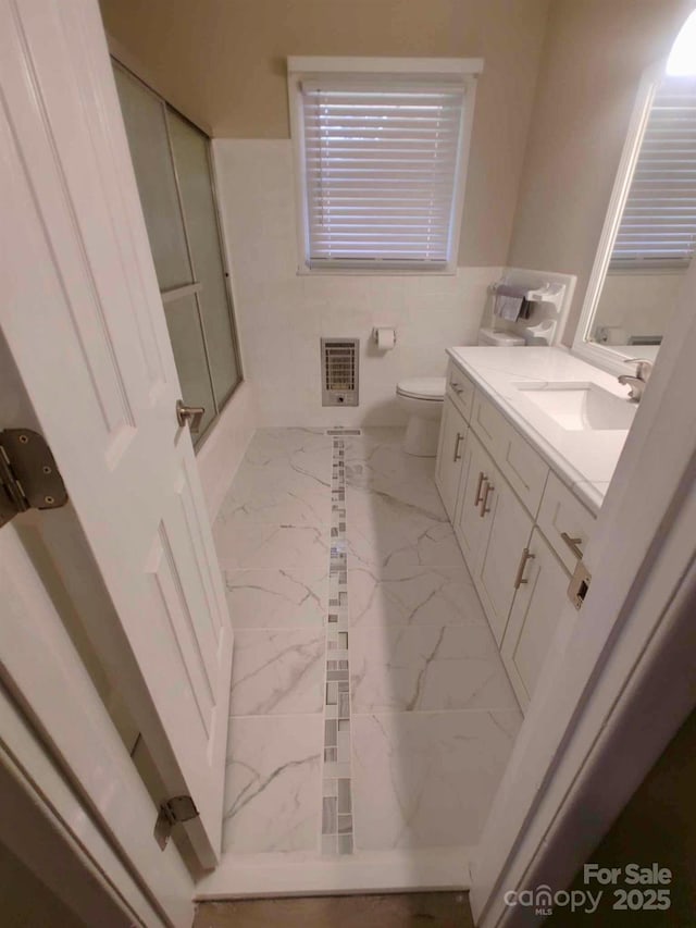 206 College Ave, Shelby, NC 28152 - full bathroom featuring marble finish flooring, vanity, and heating unit