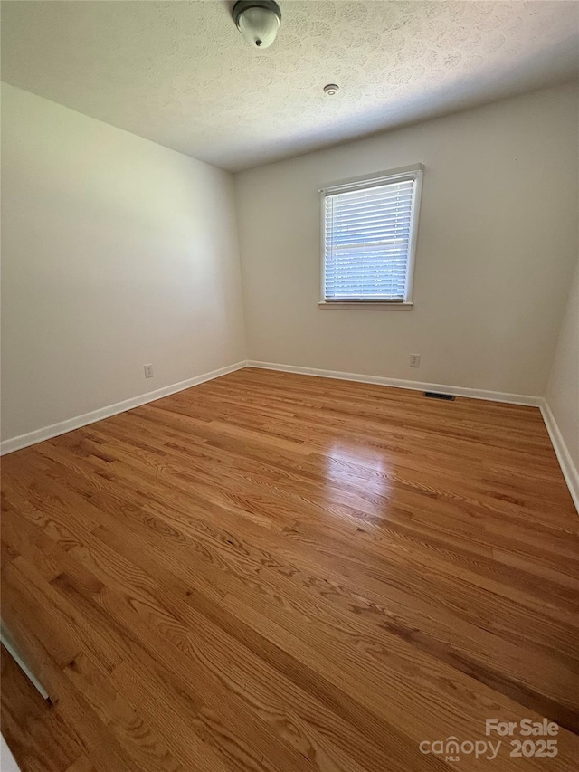 206 College Ave, Shelby, NC 28152 - unfurnished room with wood finished floors and a textured ceiling