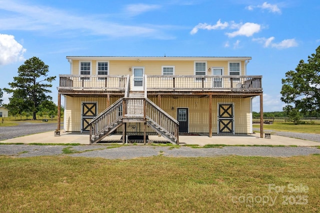 585 Clearwater Lake Rd, Kershaw, SC 29067 - rear view of property featuring a yard, a wooden deck, and stairway