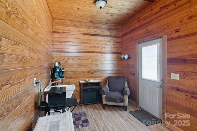 585 Clearwater Lake Rd, Kershaw, SC 29067 - sitting room featuring wooden walls, light wood-style flooring, and wooden ceiling