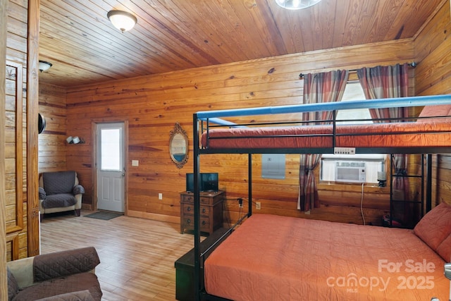 585 Clearwater Lake Rd, Kershaw, SC 29067 - bedroom featuring cooling unit, wood finished floors, wooden walls, and wood ceiling