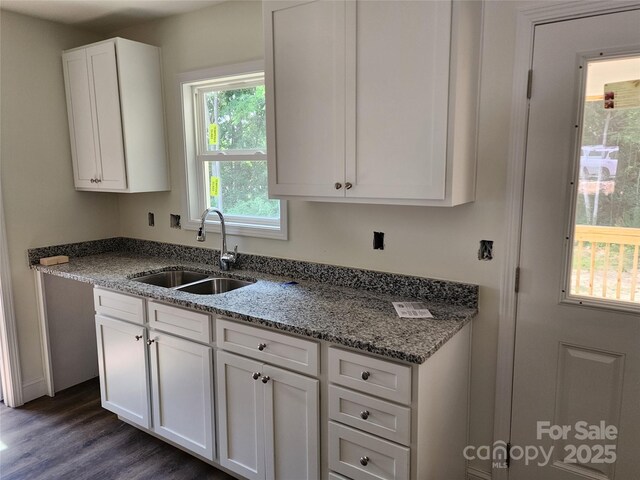 154 Hinton St, Chester, SC 29706 - kitchen with white cabinetry, dark wood finished floors, and light stone counters