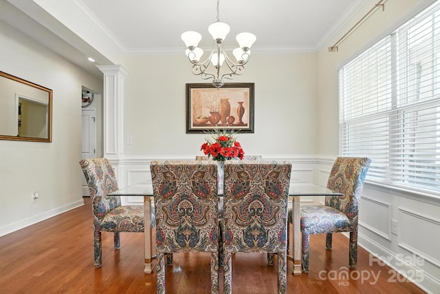 8275 Normandy Rd, Denver, NC 28037 - dining space with a chandelier, healthy amount of natural light, wood finished floors, ornamental molding, and wainscoting