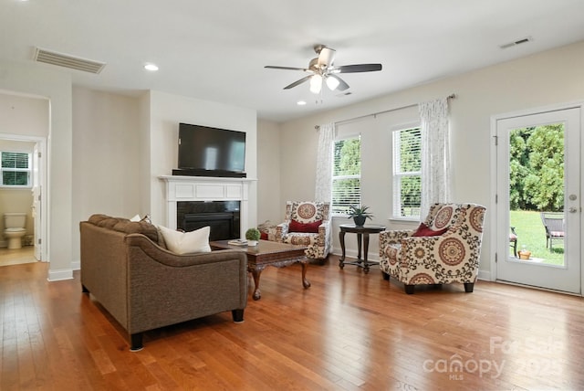 8275 Normandy Rd, Denver, NC 28037 - living room featuring hardwood / wood-style flooring, a fireplace, a ceiling fan, and recessed lighting