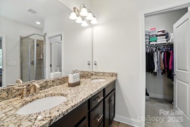 8275 Normandy Rd, Denver, NC 28037 - full bath featuring a spacious closet, a stall shower, and double vanity