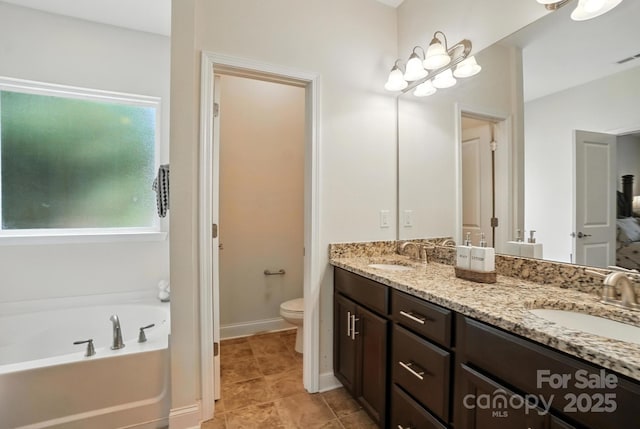 8275 Normandy Rd, Denver, NC 28037 - bathroom featuring double vanity and a bath