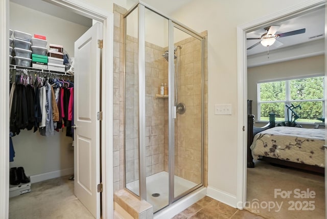 8275 Normandy Rd, Denver, NC 28037 - ensuite bathroom featuring a stall shower, ceiling fan, and a walk in closet