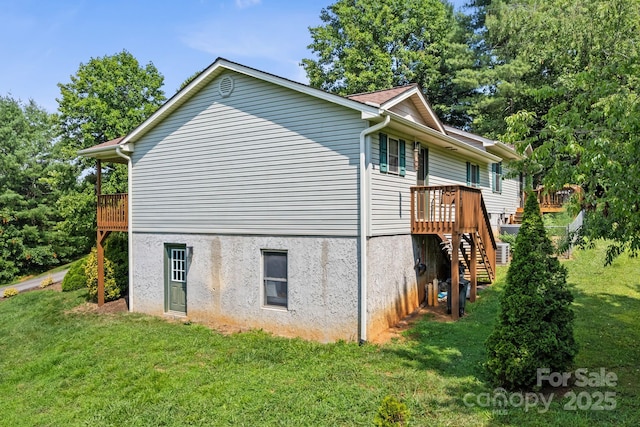 12 Buckshot Ridge Dr, Asheville, NC 28804 - view of property exterior featuring a lawn, stairs, a wooden deck, and stucco siding