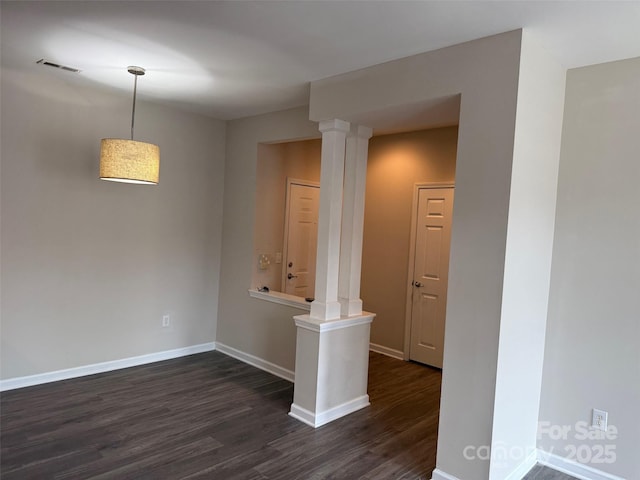 6112 Creft Cir, Indian Trail, NC 28079 - empty room featuring ornate columns and dark wood-style flooring