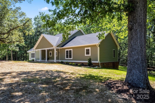 510 State Rd, China Grove, NC 28023 - view of front of property featuring covered porch, a shingled roof, crawl space, and a front yard