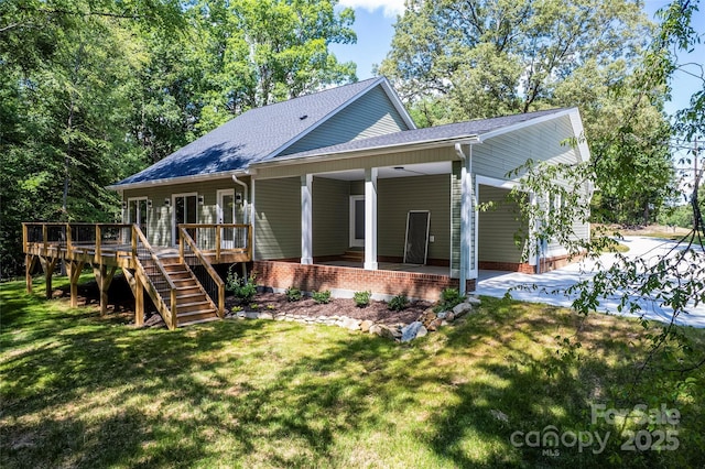 510 State Rd, China Grove, NC 28023 - back of property featuring a lawn, roof with shingles, stairs, and a wooden deck