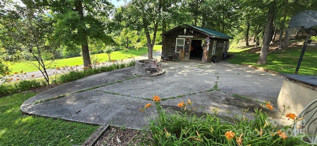 414 Pine Cove Rd, Old Fort, NC 28762 - view of patio with an outdoor structure and view of wooded area