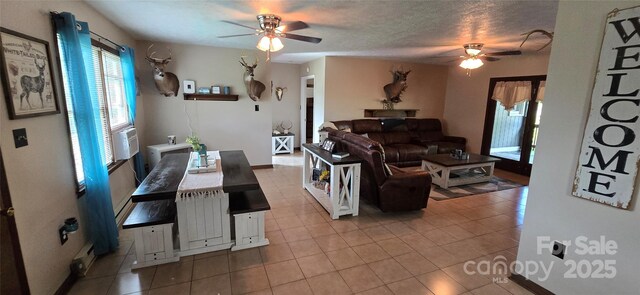 414 Pine Cove Rd, Old Fort, NC 28762 - tiled living area with ceiling fan and plenty of natural light