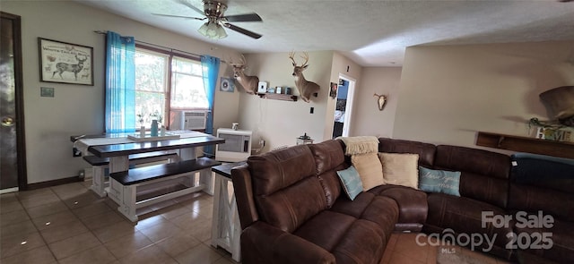 414 Pine Cove Rd, Old Fort, NC 28762 - tiled living room with a ceiling fan, cooling unit, and a textured ceiling