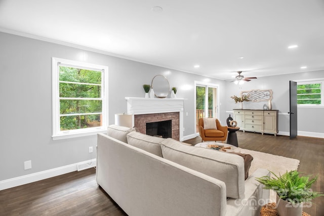 1623 Lumarka Dr, Charlotte, NC 28212 - living area with a fireplace, ceiling fan, dark wood-style flooring, ornamental molding, and recessed lighting