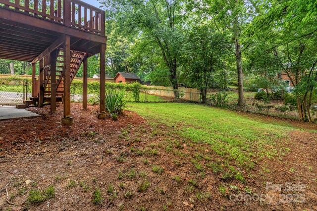 1623 Lumarka Dr, Charlotte, NC 28212 - view of yard featuring stairway and a wooden deck