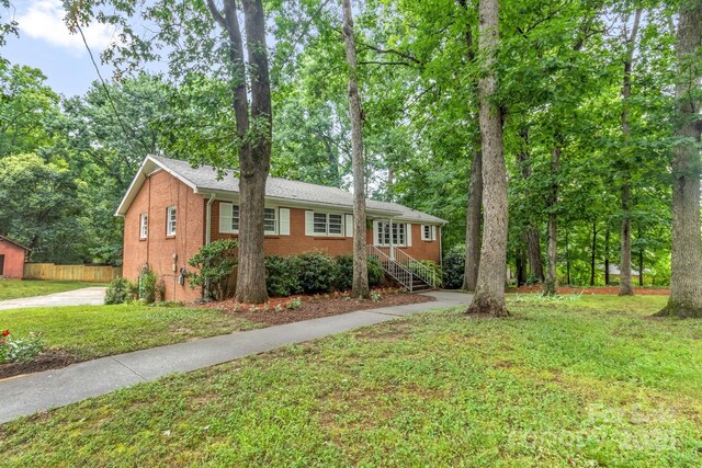 1623 Lumarka Dr, Charlotte, NC 28212 - ranch-style home featuring brick siding and concrete driveway