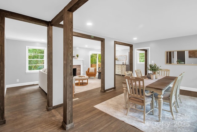 1623 Lumarka Dr, Charlotte, NC 28212 - dining area featuring wood finished floors, a fireplace, and recessed lighting