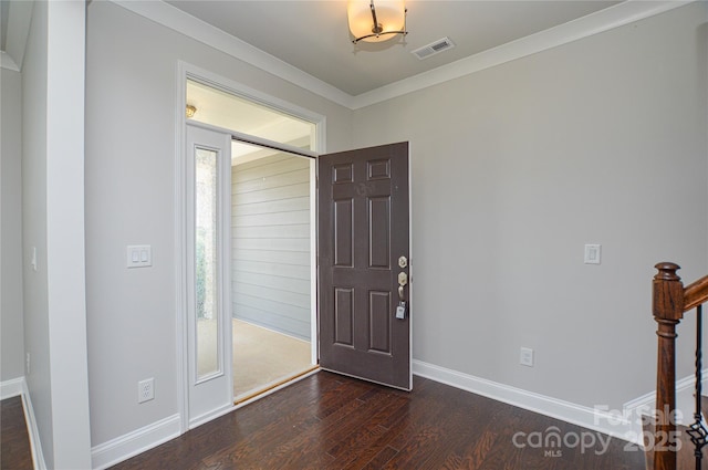 10149 Meeting House Dr NW, Huntersville, NC 28078 - foyer entrance featuring dark wood finished floors, stairs, and ornamental molding