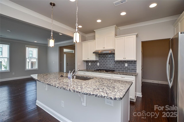 10149 Meeting House Dr NW, Huntersville, NC 28078 - kitchen with appliances with stainless steel finishes, crown molding, decorative backsplash, white cabinetry, and light stone counters