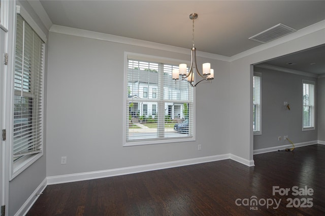 10149 Meeting House Dr NW, Huntersville, NC 28078 - spare room with dark wood-style floors, a chandelier, and ornamental molding