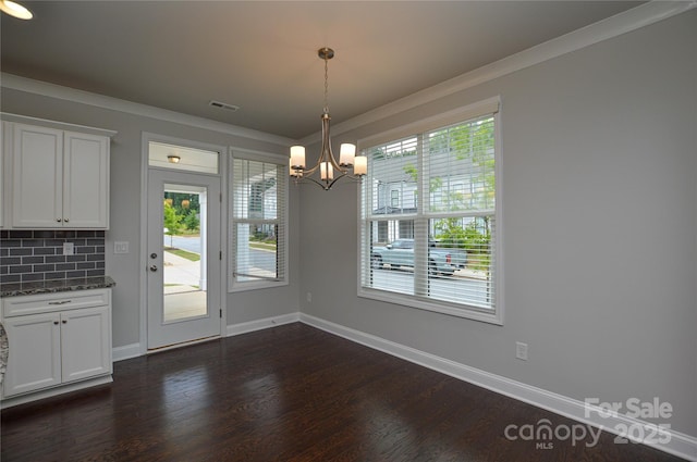 10149 Meeting House Dr NW, Huntersville, NC 28078 - unfurnished dining area featuring a chandelier, dark wood finished floors, and ornamental molding