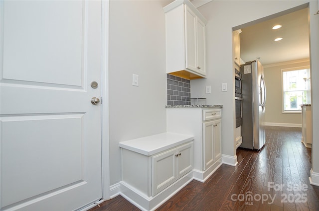 10149 Meeting House Dr NW, Huntersville, NC 28078 - kitchen with freestanding refrigerator, dark wood-type flooring, white cabinets, recessed lighting, and light countertops