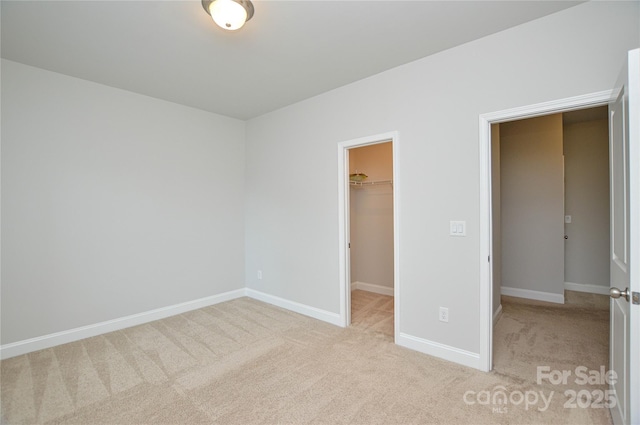 10149 Meeting House Dr NW, Huntersville, NC 28078 - unfurnished bedroom with a spacious closet, carpet flooring, and a closet