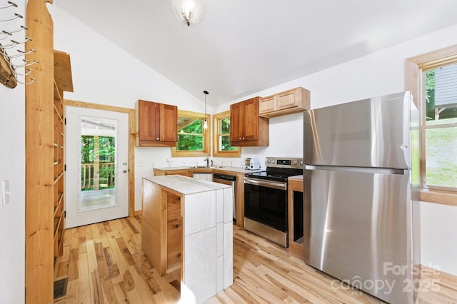 109 Azalea Ave, Swannanoa, NC 28778 - kitchen featuring appliances with stainless steel finishes, light wood-type flooring, a center island, light countertops, and high vaulted ceiling