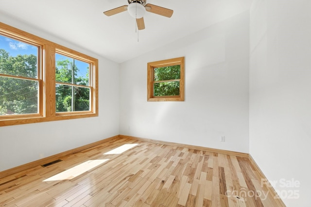 109 Azalea Ave, Swannanoa, NC 28778 - spare room with plenty of natural light, vaulted ceiling, wood finished floors, and a ceiling fan
