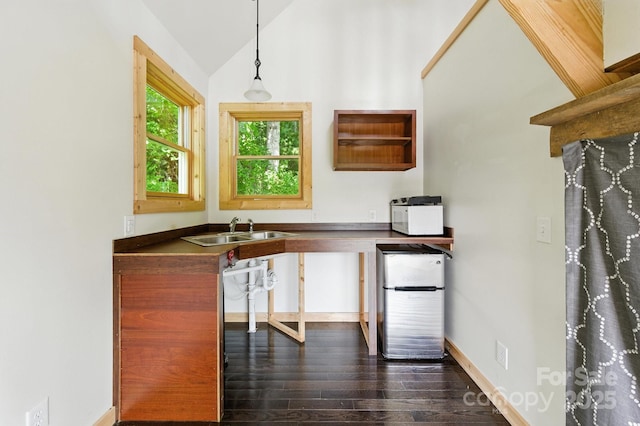 109 Azalea Ave, Swannanoa, NC 28778 - kitchen featuring freestanding refrigerator, lofted ceiling, dark wood-style flooring, dark countertops, and hanging light fixtures