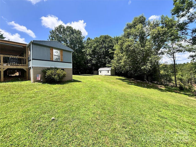 1890 Bud Tilley Rd, Pinnacle, NC 27043 - view of green lawn featuring a storage shed