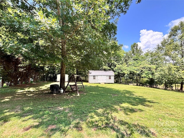 1890 Bud Tilley Rd, Pinnacle, NC 27043 - view of green lawn featuring a storage unit