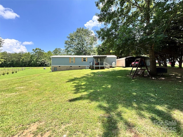 1890 Bud Tilley Rd, Pinnacle, NC 27043 - view of grassy yard featuring a carport