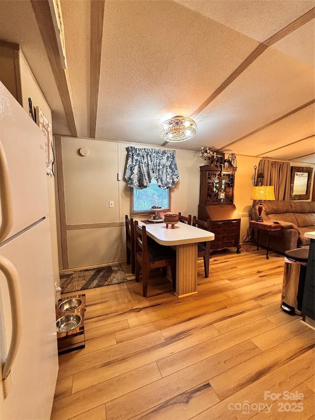 1890 Bud Tilley Rd, Pinnacle, NC 27043 - dining area with light wood-style floors and a textured ceiling